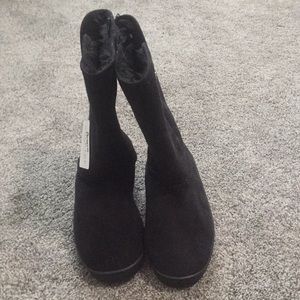 Size 7. Furry calf length boots. NWT.